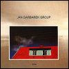 Jan Garbarek - Photo With Blue Sky, White Cloud, Wires, Windows And A Red Roof